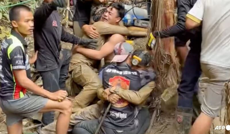 Survivors advise rescuers in search for last two stuck in Laos cave