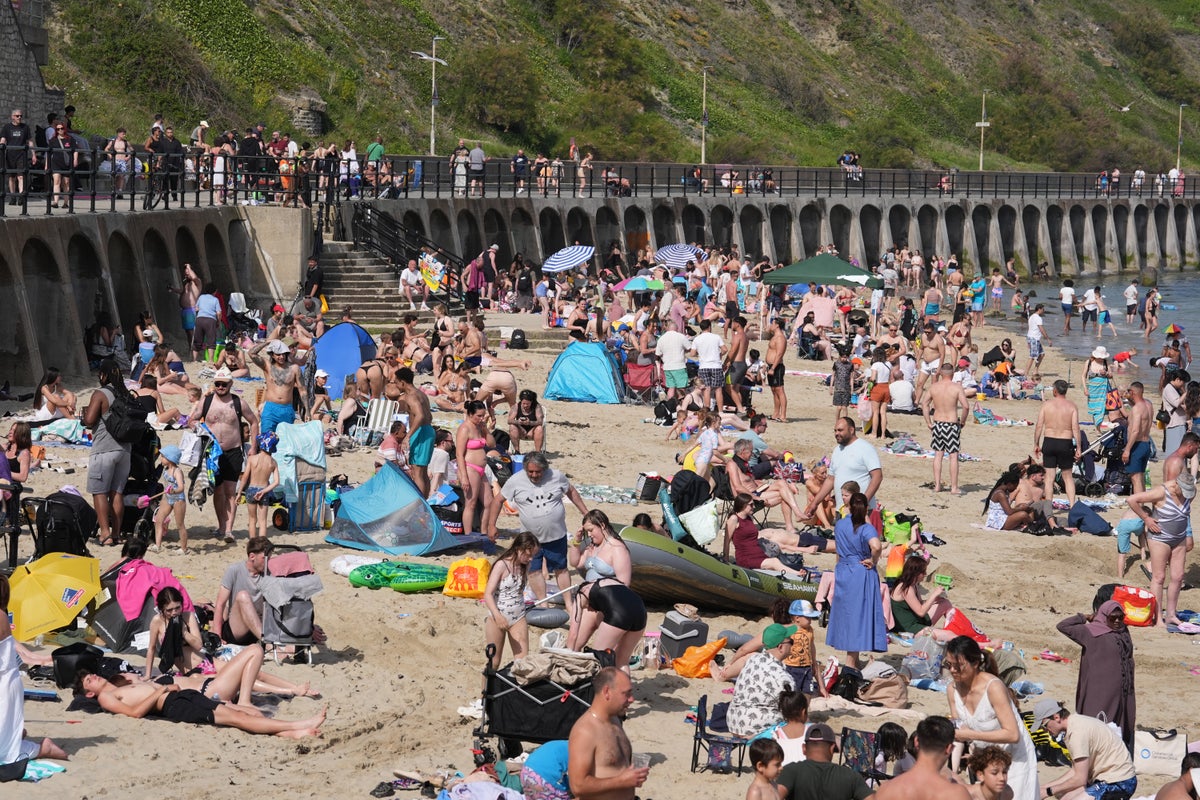 UK heatwave officially declared as temperatures top 32C on hottest day of the year so far