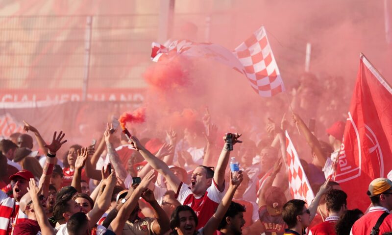 In pictures: Arsenal fans celebrate Premier League title as thousands flock to Emirates Stadium