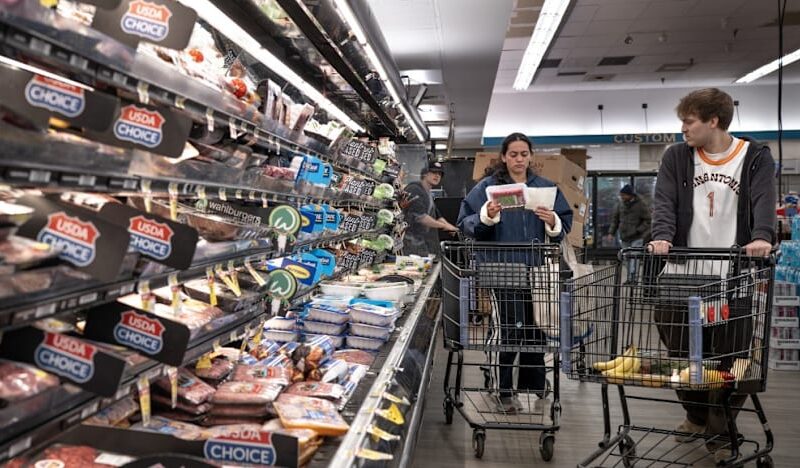 US revises first quarter growth down while inflation climbs