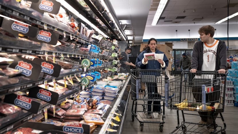US revises first quarter growth down while inflation climbs