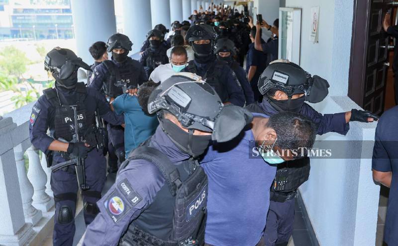 11 men charged over alleged organised crime group Geng RT6