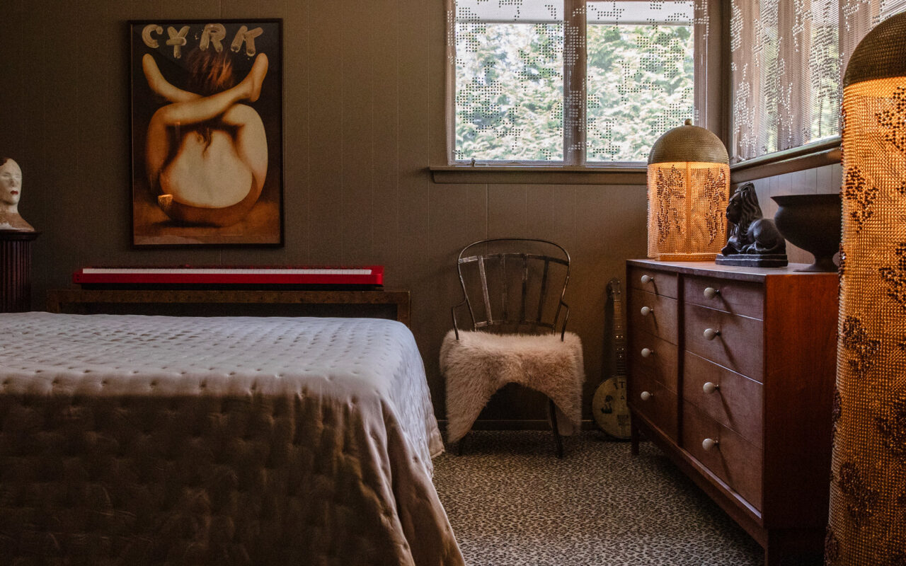 A Bedroom Where Leopard-Print Carpeting and Green Walls Do the Talking
