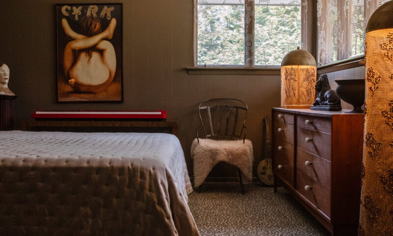 A Bedroom Where Leopard-Print Carpeting and Green Walls Do the Talking