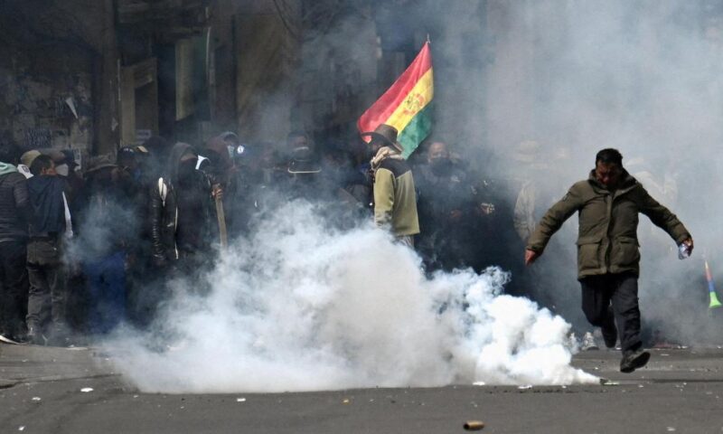 Police, protesters clash in new marches against Bolivian leader