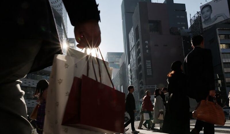 Japan keeps view economy recovering but warns risk from Middle East