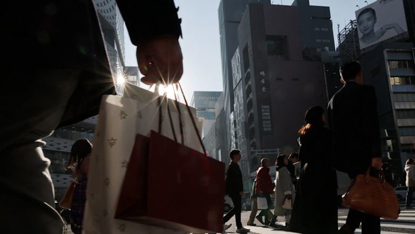 Japan keeps view economy recovering but warns risk from Middle East