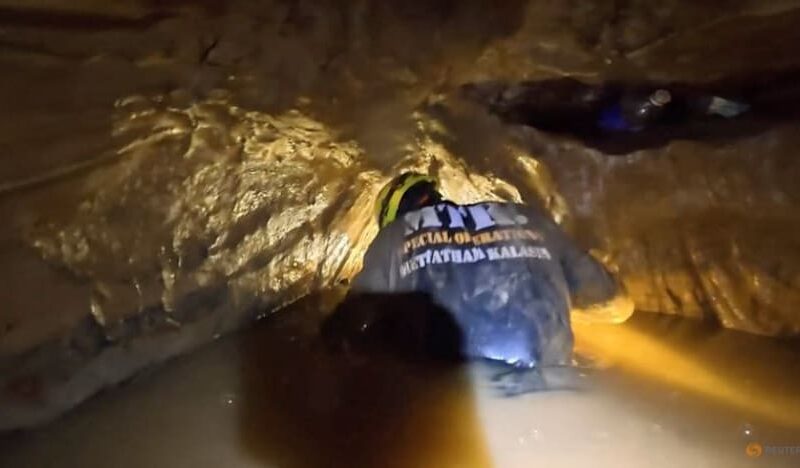 ‘It’s like diving into coffee’: Rescuers in Laos describe risky mission to free men trapped in cave
