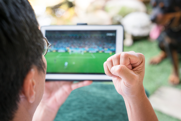 Football fans admit to checking match scores at weddings and funerals