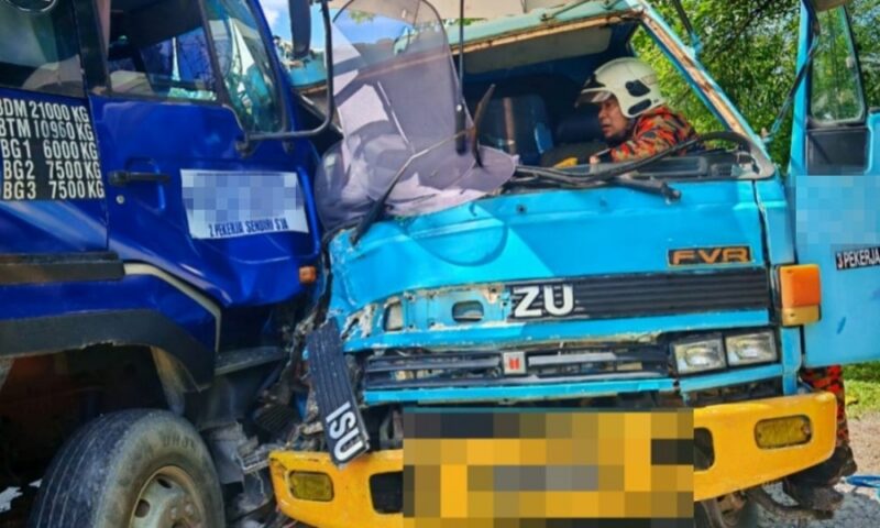 Driver pinned in cab, fractures leg in two‑lorry collision near Bau