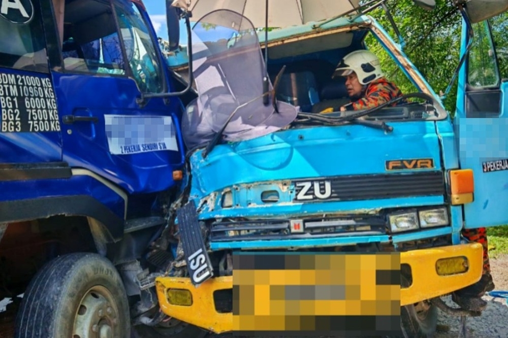 Driver pinned in cab, fractures leg in two‑lorry collision near Bau