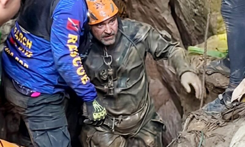 Rescuers race against time to reach seven trapped in flooded Laos cave