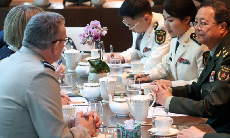 Chinese and UK officials at Shangri-La Dialogue vow to strengthen military ties