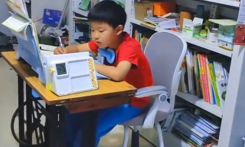 China mum makes son pedal sewing machine during homework to stay focused, sparks debate