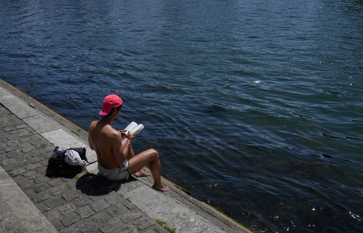 Parts of Europe swelter in record May heat as deaths at amateur sports events spur warnings