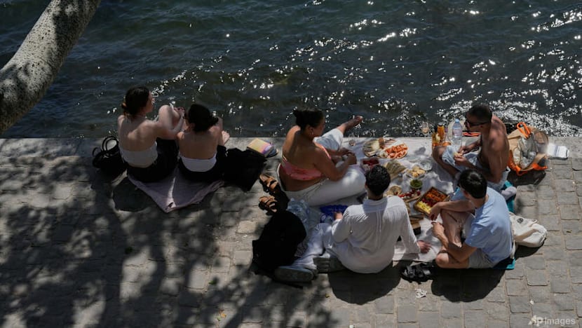 Parts of Europe swelter in record May heat as deaths at amateur sports events spur warnings