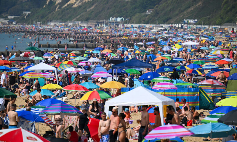 Brits bask in scorching sun as record-high temperatures beat down
