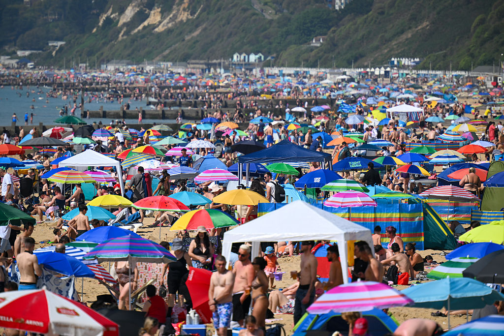 Brits bask in scorching sun as record-high temperatures beat down