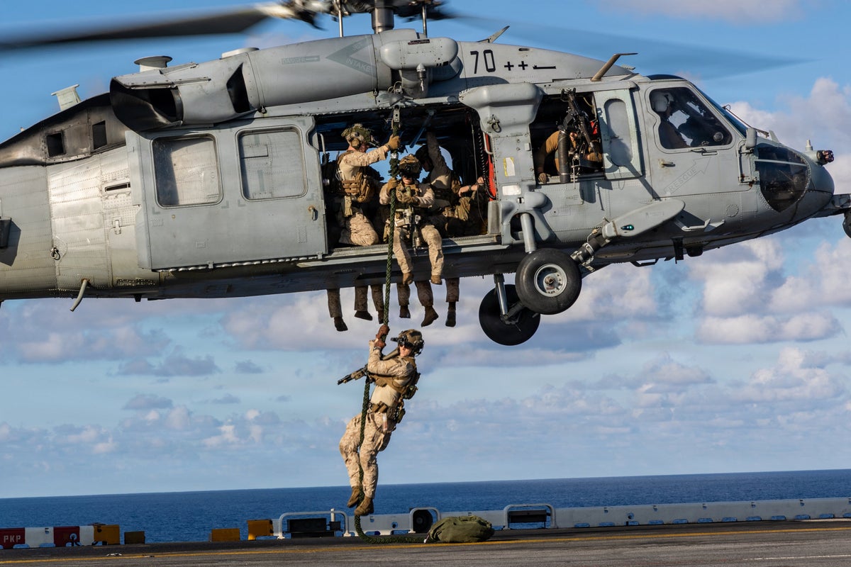 Military has spent months building up ships and personnel in Caribbean and is ready for invasion of Cuba: report