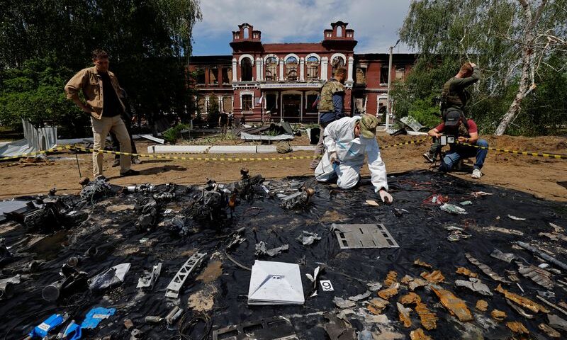 Forensic experts sift through ruined dormitory in Russian-held Luhansk region