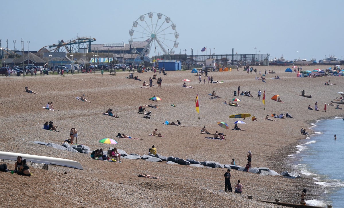 Man dies on packed beach on hottest day of the year after ‘medical emergency’