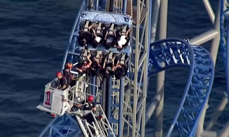 Rollercoaster riders stuck on 100ft vertical hill for hours after malfunction