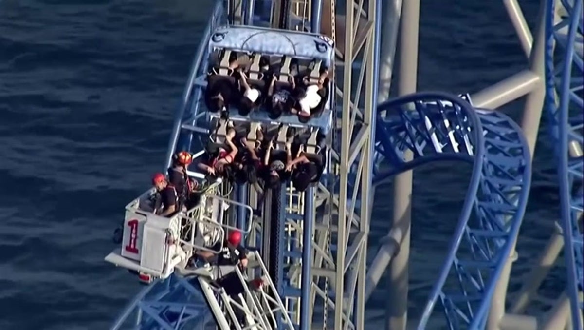Rollercoaster riders stuck on 100ft vertical hill for hours after malfunction