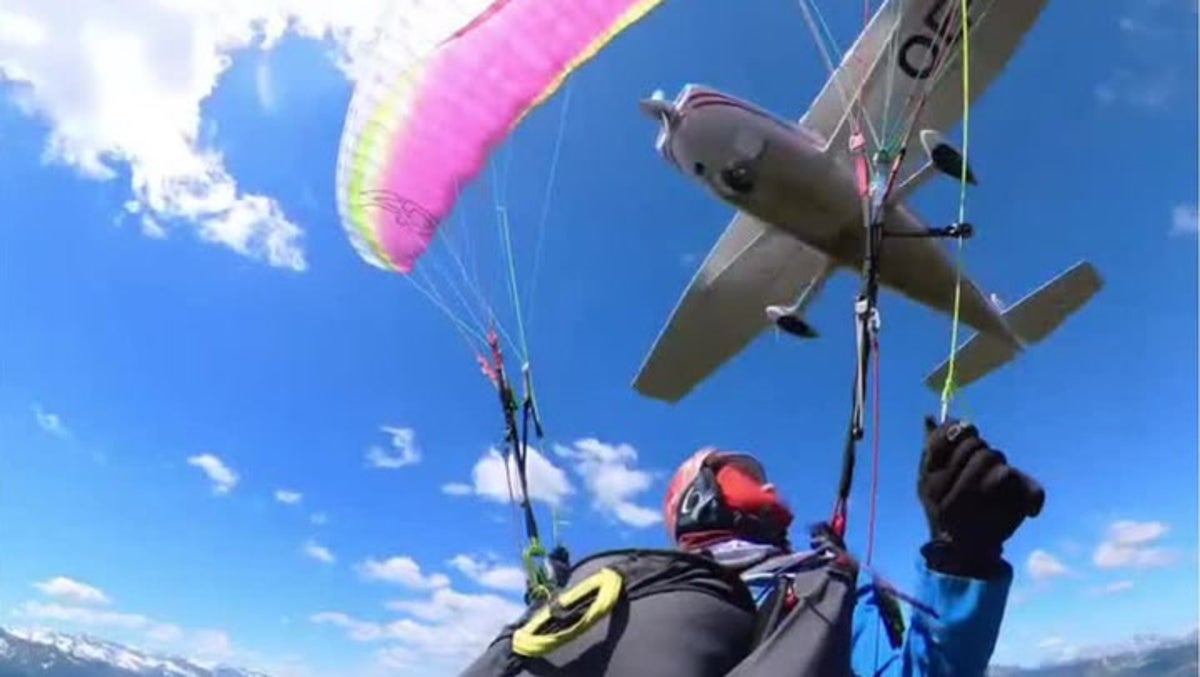 Plane crashes into paraglider and sends her spiraling through the air