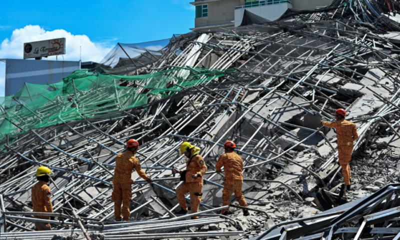 One killed and many feared trapped under collapsed building in Philippines