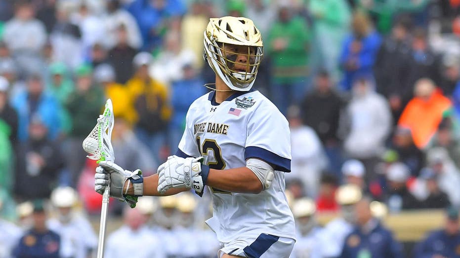 Notre Dame’s Josh Yago delivers Memorial Day salute during anthem before lacrosse championship game