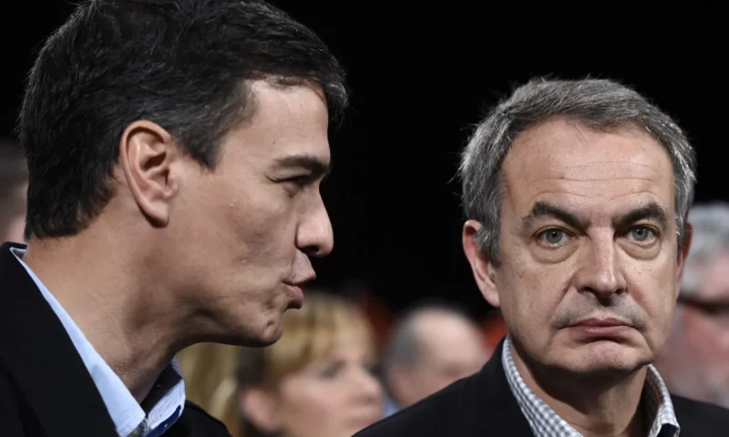 Spain’s PM keeps backing ex-leader targeted in corruption probe