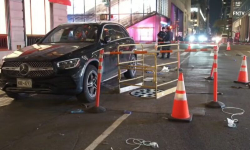 Woman dies after falling into manhole