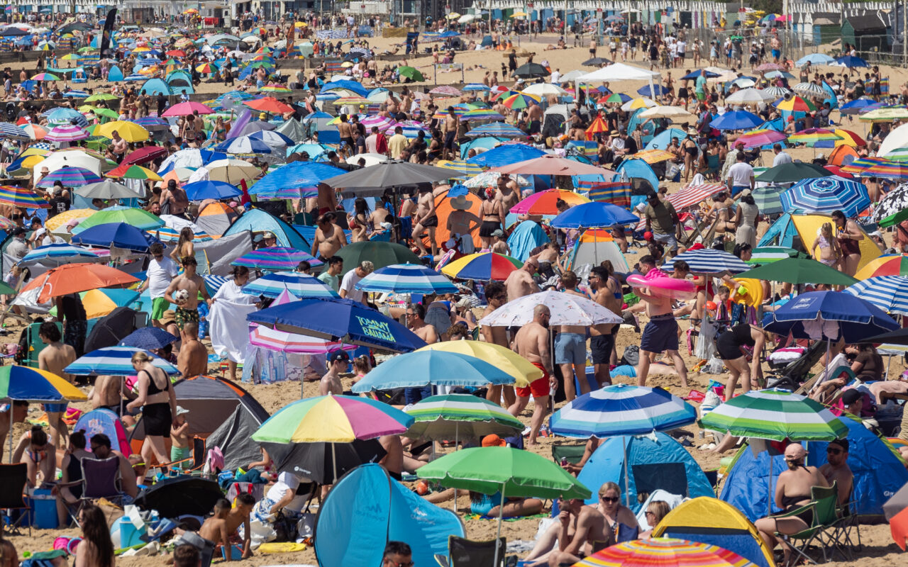 Brits pack beaches on UK’s hottest day – with MORE sunshine to come as temperatures could hit 35C on bank holiday Monday