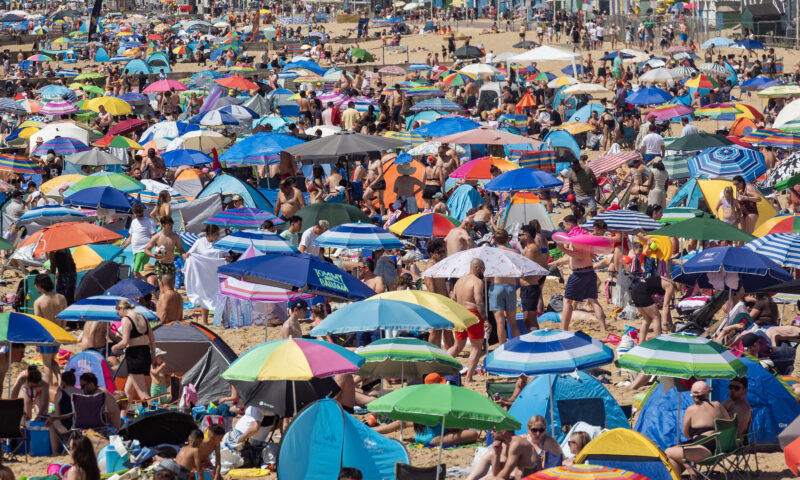Brits pack beaches on UK’s hottest day – with MORE sunshine to come as temperatures could hit 35C on bank holiday Monday