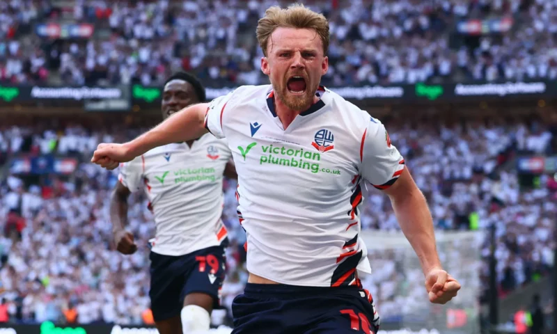 Bolton 4 Stockport 1: Trotters seal stunning return to Championship after seven-year absence with Wembley thumping