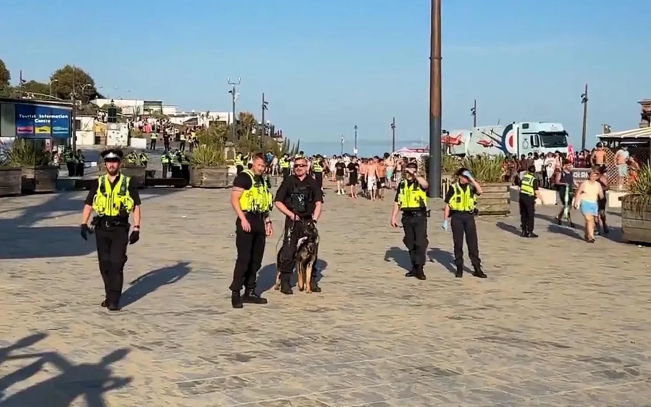 Cops assaulted at popular beach & officers make arrests after a large number of people become disorderly