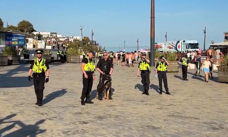 Cops assaulted at popular beach & officers make arrests after a large number of people become disorderly