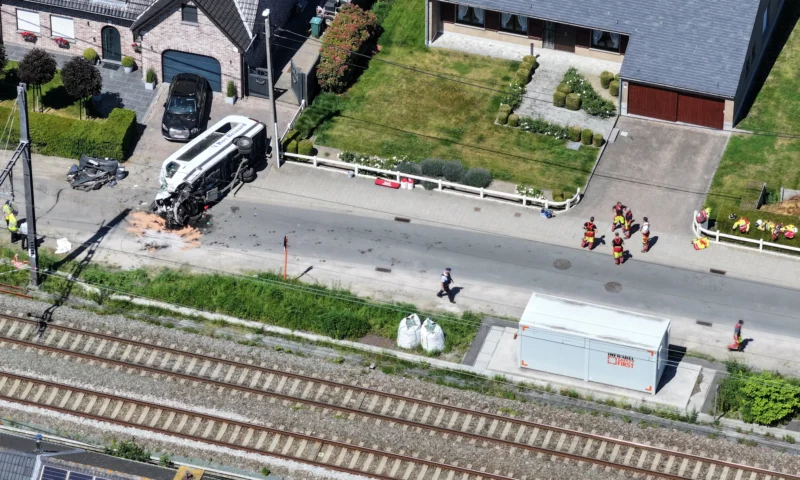School bus hurled 50ft into pylon in crash with 75mph train after driver ‘broke through’ crossing barrier leaving 4 dead