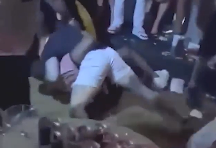 Moment huge nightclub brawl erupts as shirtless tourists smash liquor bottles over heads & punch each other