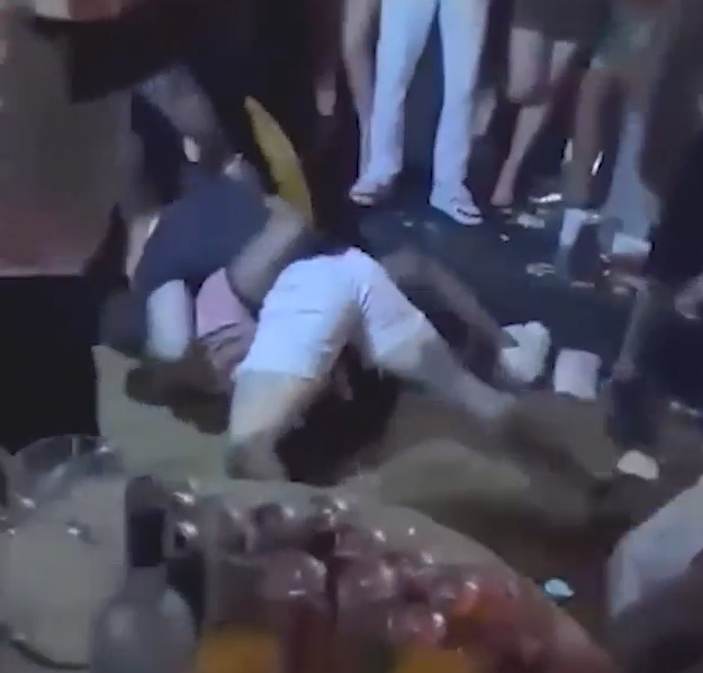 Moment huge nightclub brawl erupts as shirtless tourists smash liquor bottles over heads & punch each other
