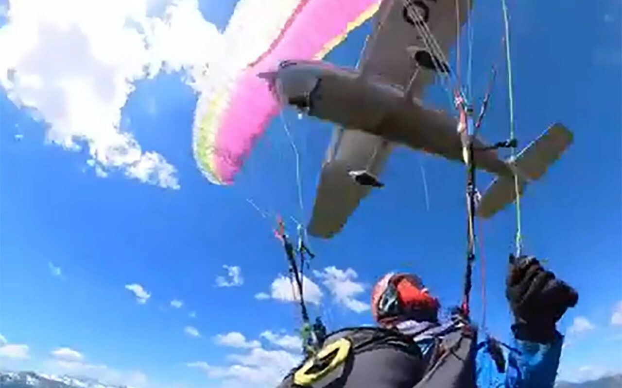 Terrifying moment plane CRASHES into paraglider sending woman spiralling mid-air – before she miraculously lands