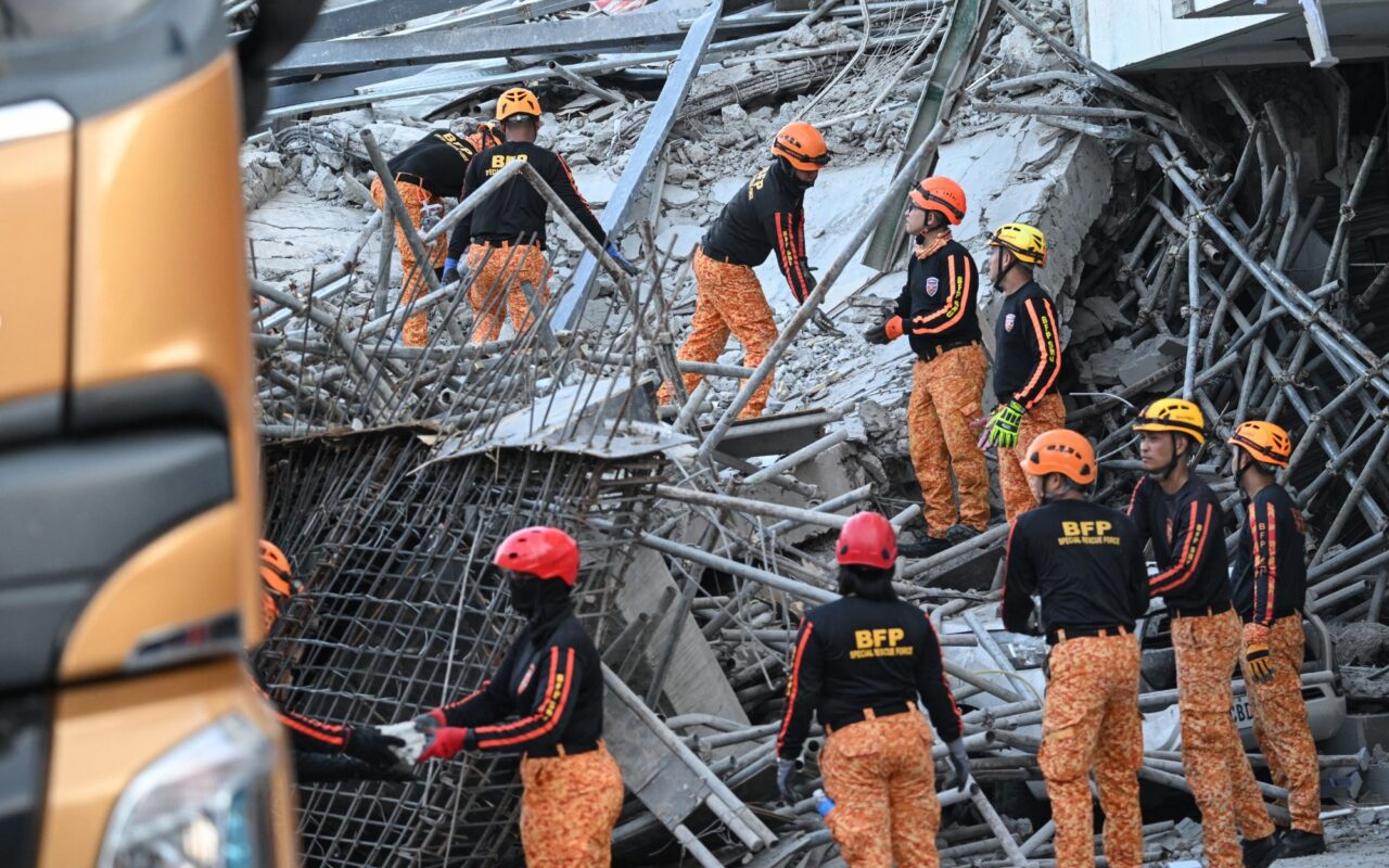 At least one dead and over 20 trapped in rubble after building collapses in Philippines – as major rescue op underway