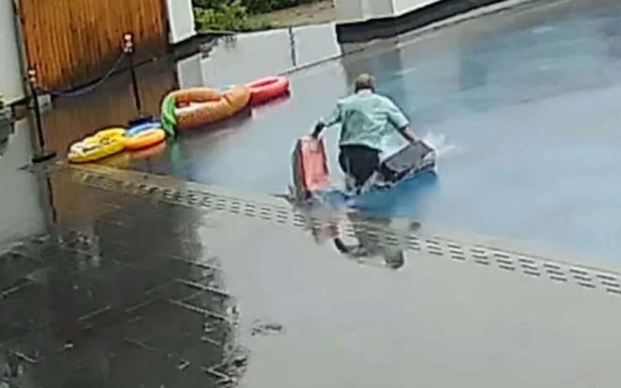 Moment hapless hotel porter walks straight into pool thinking it’s a rainy car park leaving guests’ luggage drenched