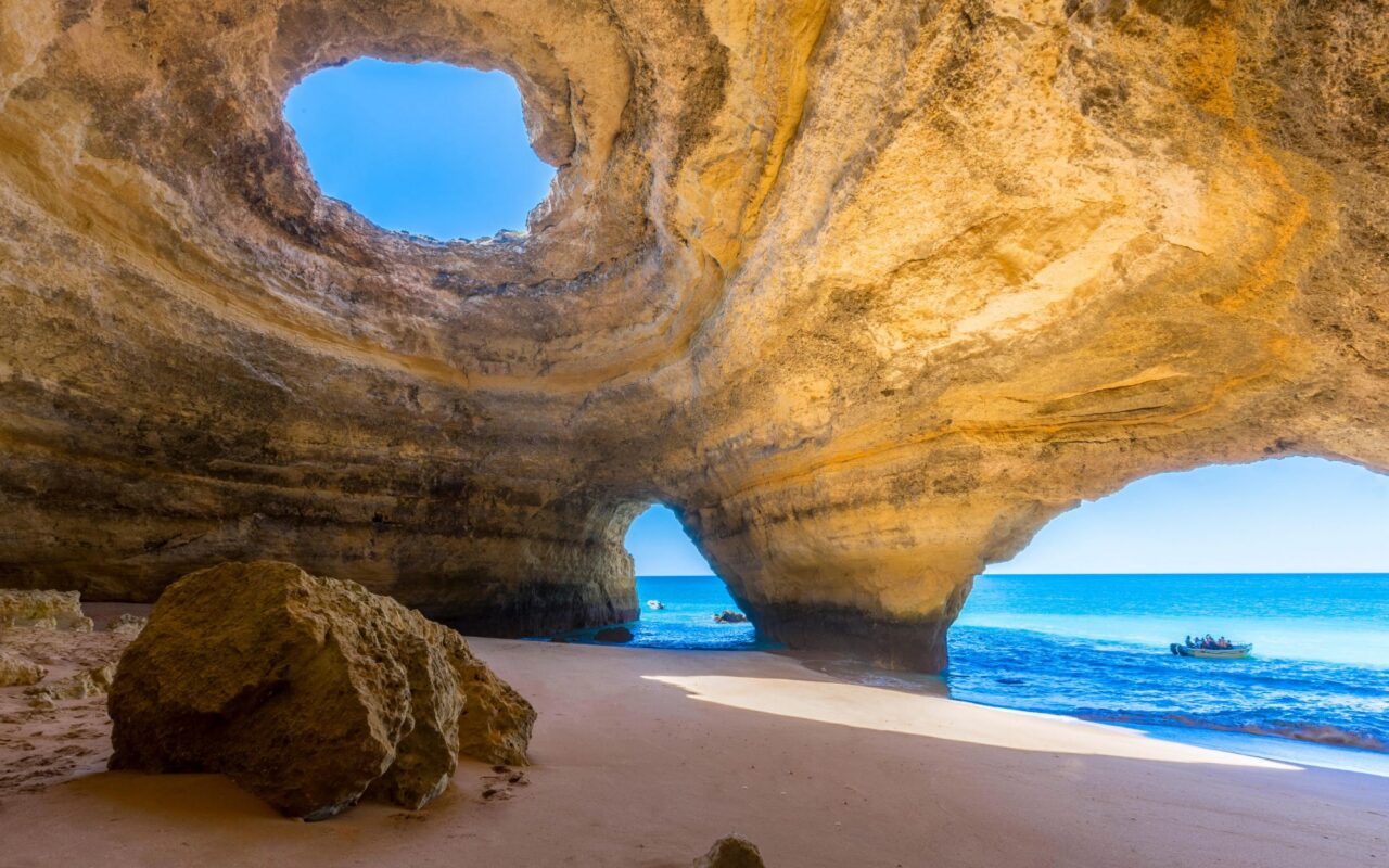 Boat carrying 16 including five children capsizes in popular tourist cave in Portugal as two left injured