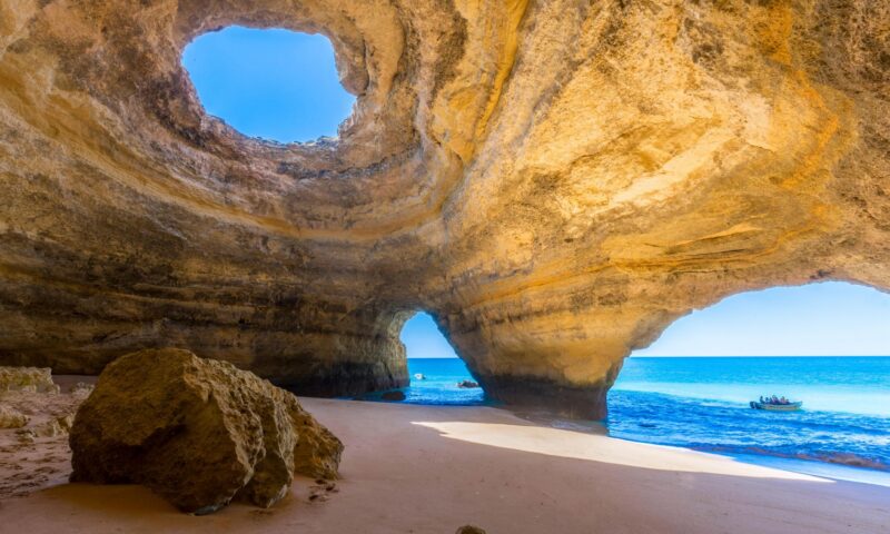 Boat carrying 16 including five children capsizes in popular tourist cave in Portugal as two left injured