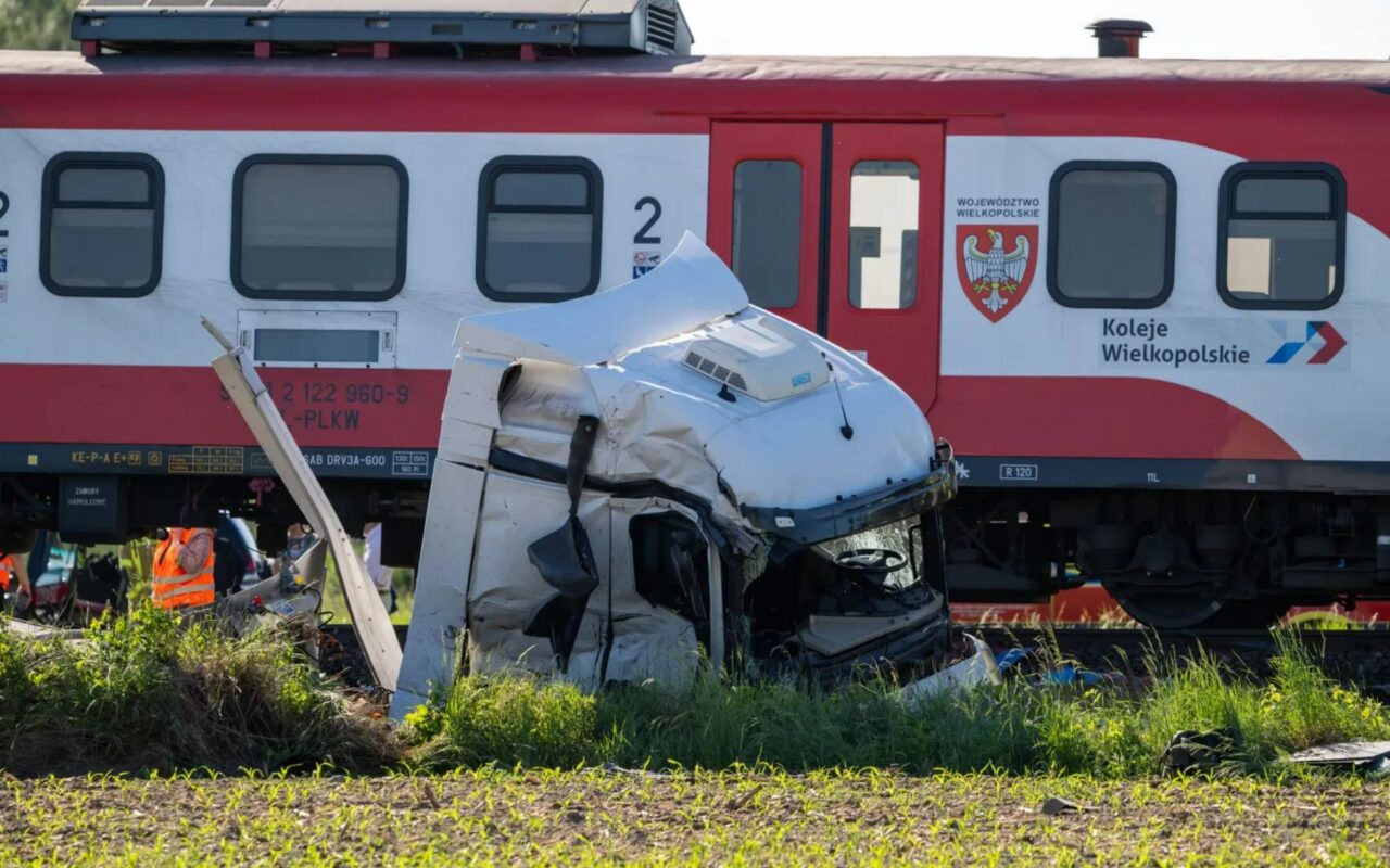 At least one dead and 18 injured as train derails after smashing into lorry in Poland