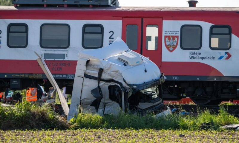 At least one dead and 18 injured as train derails after smashing into lorry in Poland
