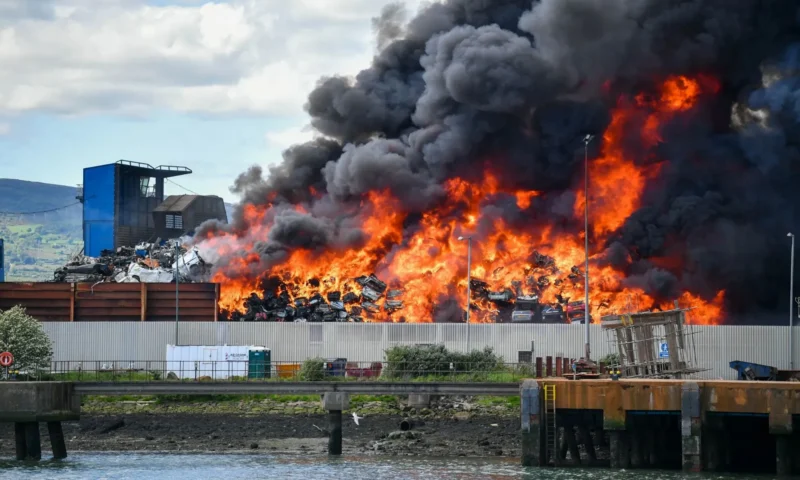 Huge blaze in Belfast’s Titanic Quarter with plumes of smoke seen across city as firefighters at scene tackling inferno