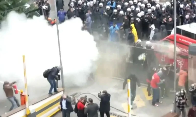 Moment riot police storm opposition party offices with tear gas as Turkish politicians barricade themselves inside