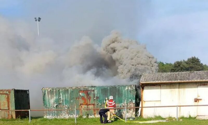 Boy, 11, trapped inside burning storage container at sport club rushed to hospital as teen arrested for attempted murder